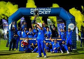 The victorious French team celebrate with the trophy.