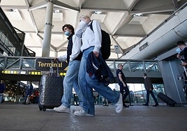 Passengers arriving at Malaga Airport.