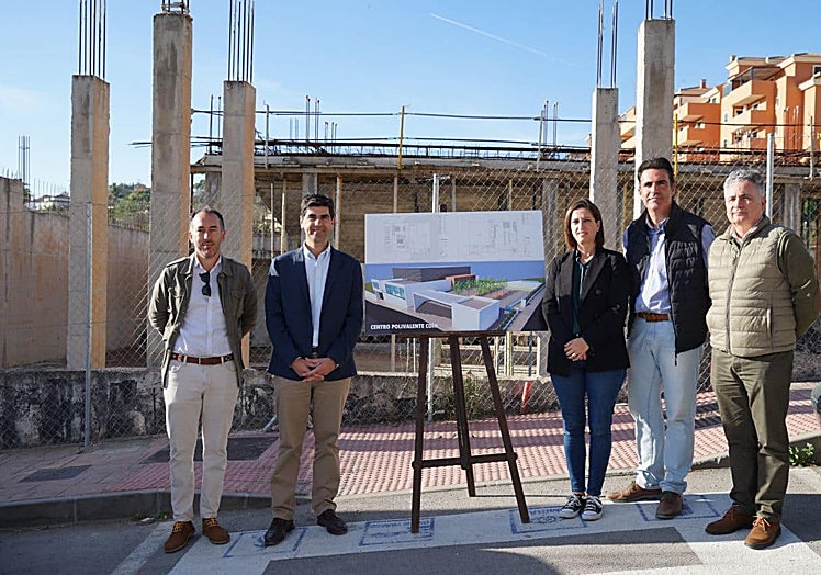 The town's mayor (2L) visits the site of the theatre.