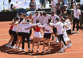 The Spain team celebrates victory on centre court in Marbella.