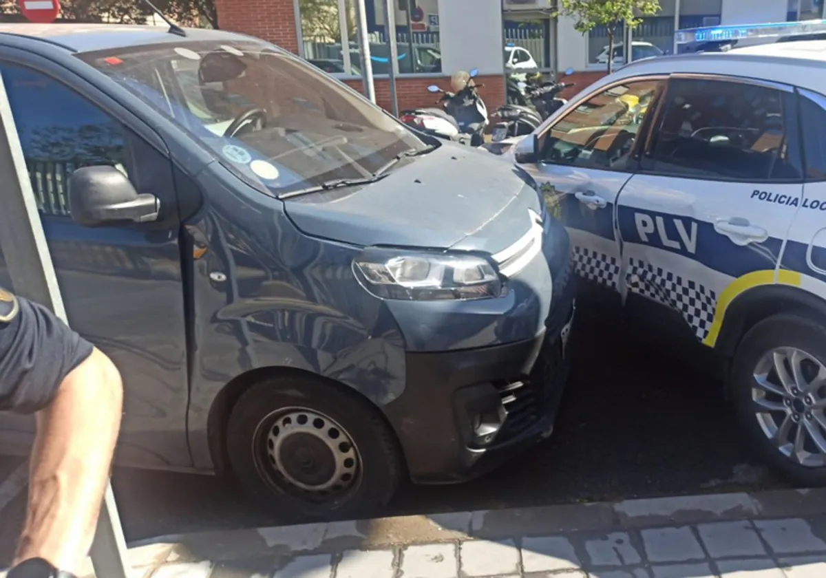 The van wedged up against the local police car