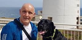 Jon Lutkin, with Spencer, a former RGP explosives dog, who he adopted in 2020.