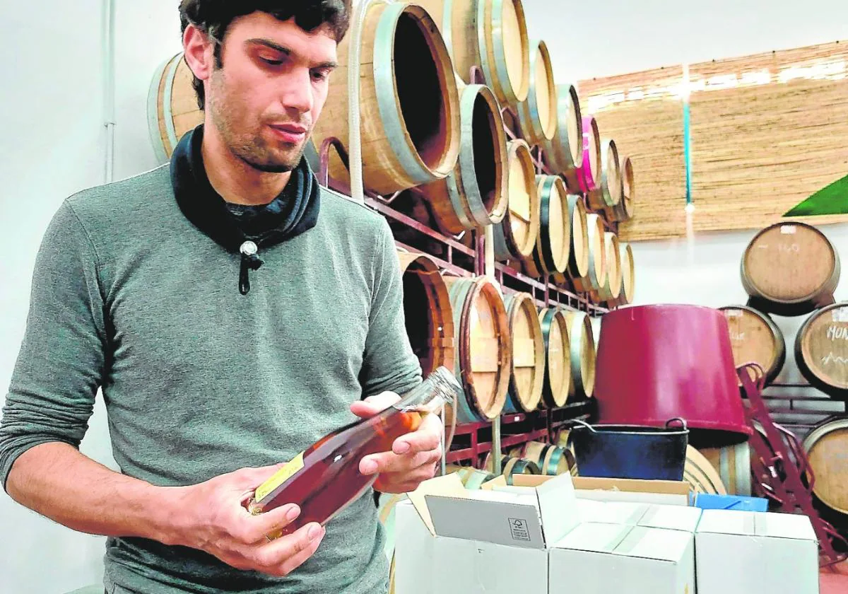 Samuel Párraga with one of his wines which is currently resting in the bodega.