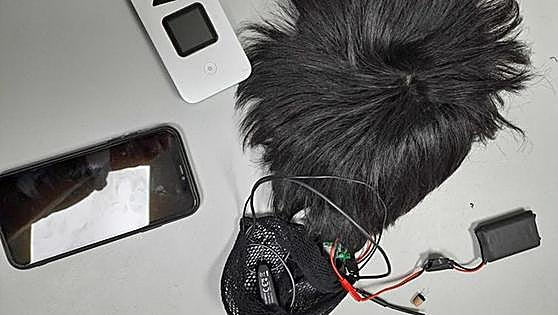 Man caught cheating on Spanish driving test with a camera and earpiece hidden under wig