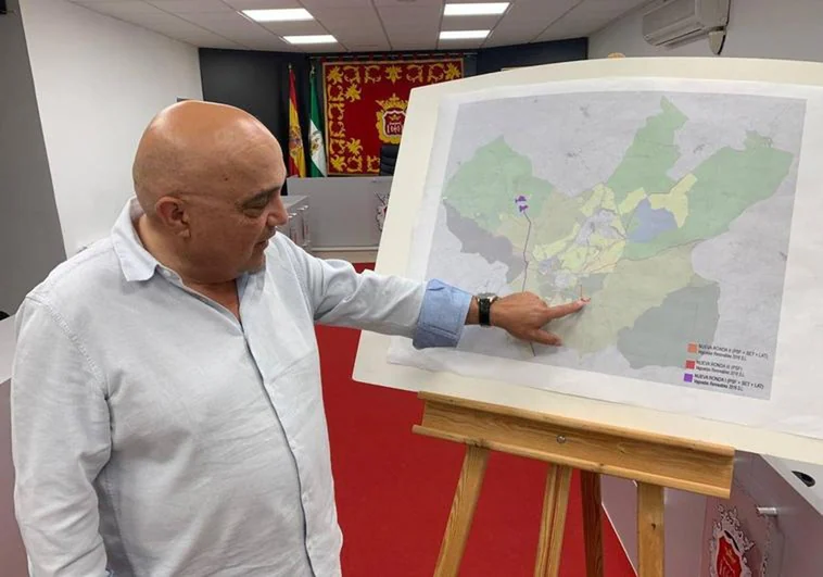 Ronda councillor Jesús Vázquez pointing to where the solar farms would have been developed.
