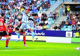 Malaga keep faint chance of a miracle alive