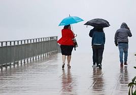 People out in the rain in Malaga on Sunday.