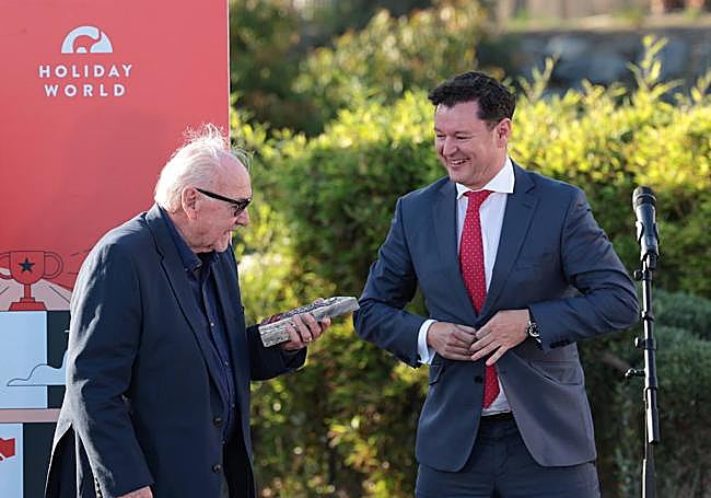 Alan James (left) recieves his award.