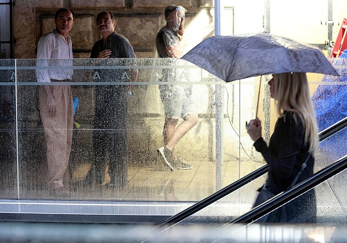 A metro passenger enters the Alameda station in Malaga city centre.