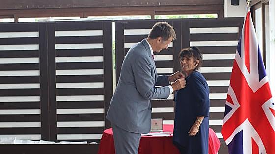 Anne Hernández receives her MBE from British Ambassador