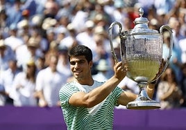 The 20-year-old lifts the trophy at Queen's.