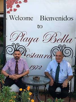 Javier and Pepe, second and first generation of the restaurant, at the door of the establishment.