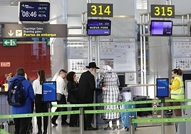 Check-in counter for a New York flight at Malaga Airport.