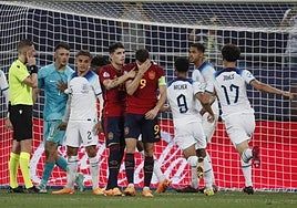 The England players celebrate after Abel Ruiz's penalty miss.