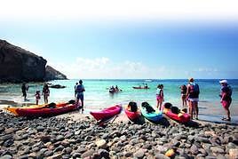 A kayak tour takes a break at Cala Higuera, a popular swimming spot in Cabo de Gata.