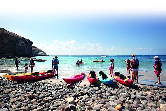 A kayak tour takes a break at Cala Higuera, a popular swimming spot in Cabo de Gata.