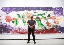 Jorge Galindo with one of his large-scale works in Wild Flowers, at the CAC Malaga.