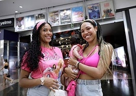 Dressing in pink has become 'a thing' for audiences going to watch Barbie, like these moviegoers in Malaga.