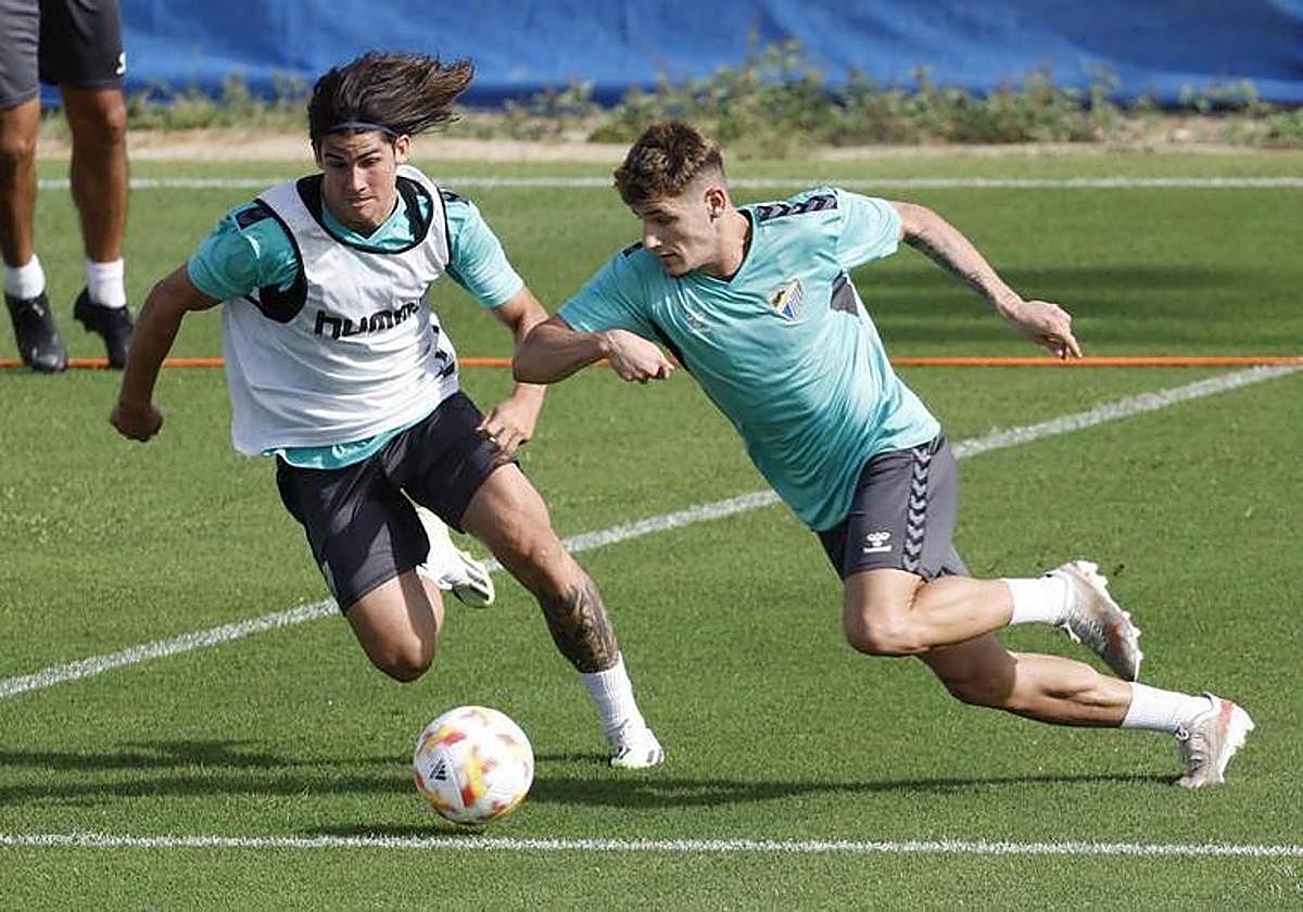 Álex Calvo and Cristian during preseason training.