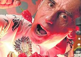 Carlos Carvajal, with a Carolina Reaper chilli.