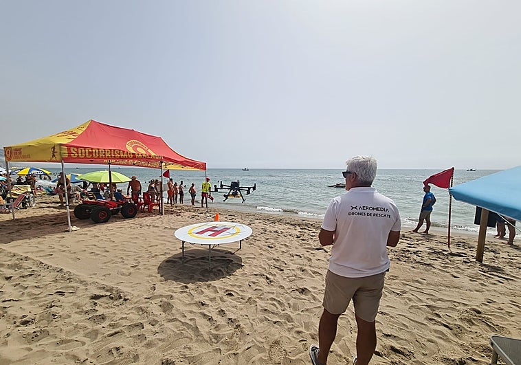 Moisés Jiménez, coordinator of the drone service, flies one of the drones on the beach in Fuengirola