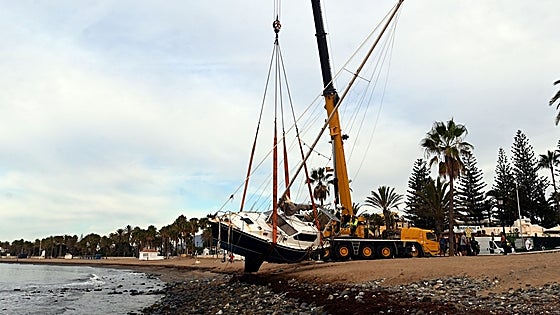 Huge crane finally removes the sailboat stranded on San Pedro beach after almost two-month delay