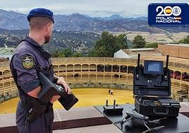A National Police officer monitors the Ronda bullring