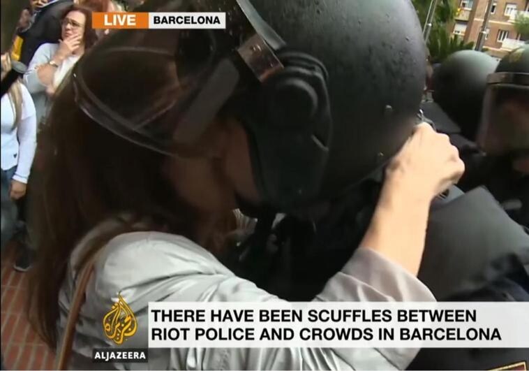 Watch... riot policeman in Spain files sexual assault complaint against woman protester for this kiss
