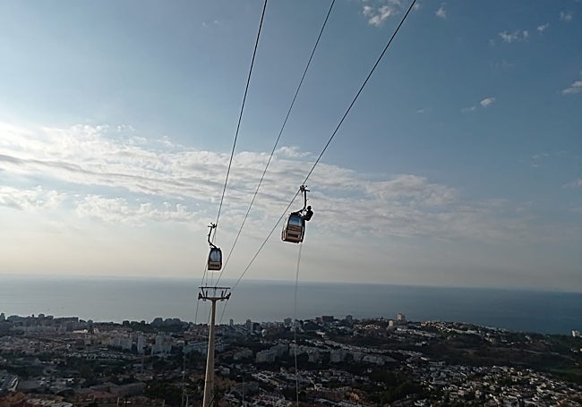 Fireman on top of one of the cable car cabins.