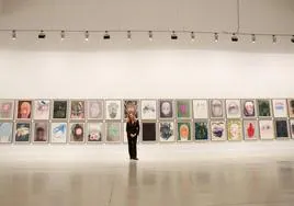 The German-Brazilian artist in front of her self-portraits.