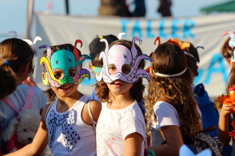 Children during a mask-making workshop at a previous festival.