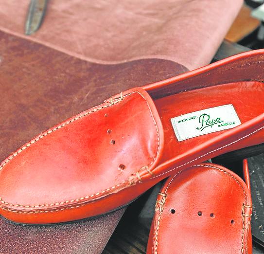 The label inside the shoes still carries the name of the business’s former owner and Vera’s teacher.