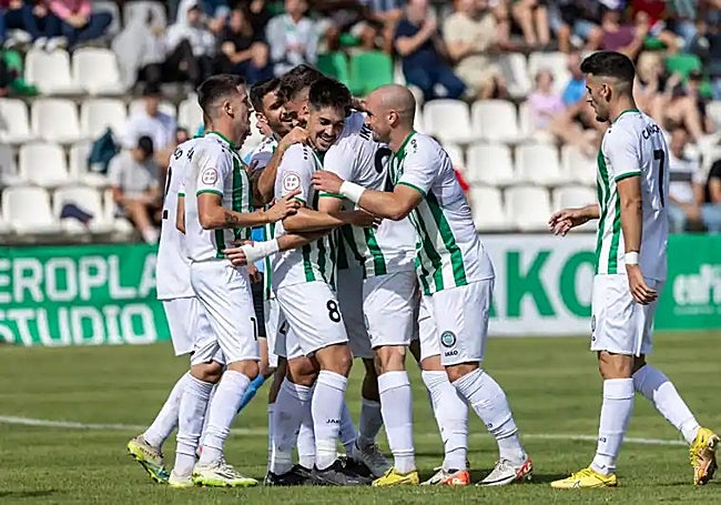 The Torremolinos players celebrate one of their goals.