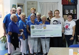 The Lions present the cheque to Apaffer volunteers.