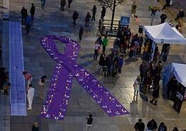 A giant purple ribbon remembering victims of domestic violence in Malaga on Thursday evening.