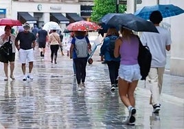 What is the weather forecast for Malaga province during the long holiday weekend