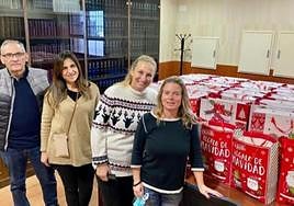 Johanna (r) and Eva (2r) delivering the gifts last year.