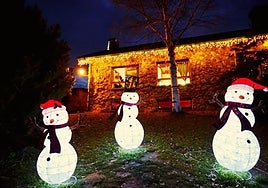Inside the house, adorned with snowmen outside, is Father Christmas himself.