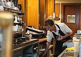 Serving customers in a bar in Madrid.