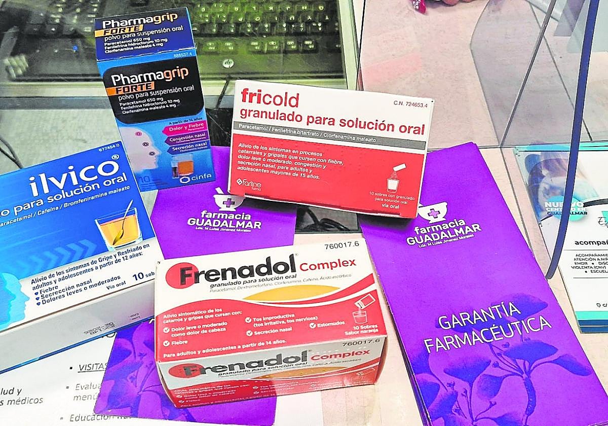 A collection of over-the-counter remedies for respiratory-tract illnesses at a Malaga pharmacy.
