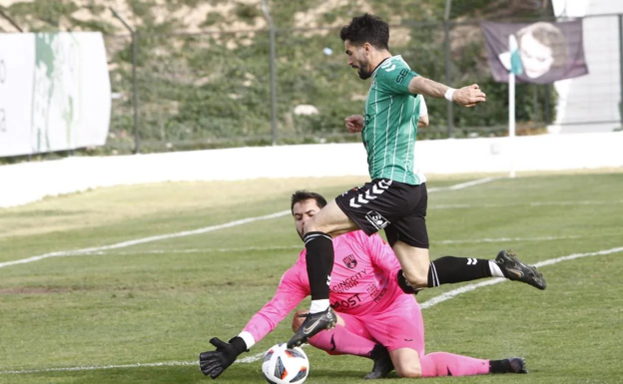 Antequera's Montori attempts to take the ball around the keeper.