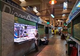 A customer is served at fishmonger's Diego García, one of the few stalls open this week.
