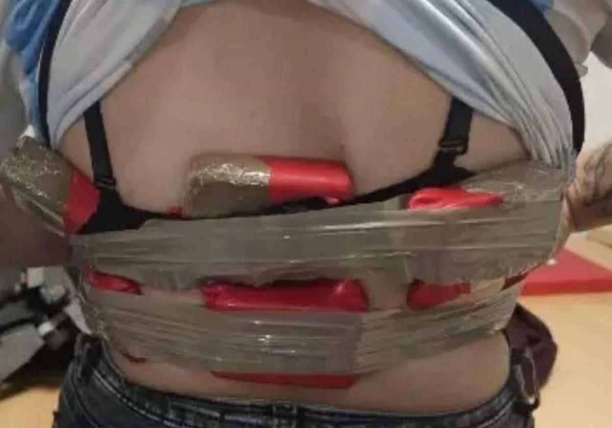 The packages of drugs strapped to the woman's body.
