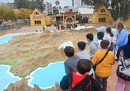 School pupils look at the spruced up map of Spain.