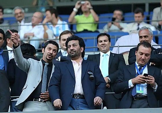 Sheikh Al-Thani (centre), alongside Moayad Shatat (left) during a Malaga game.