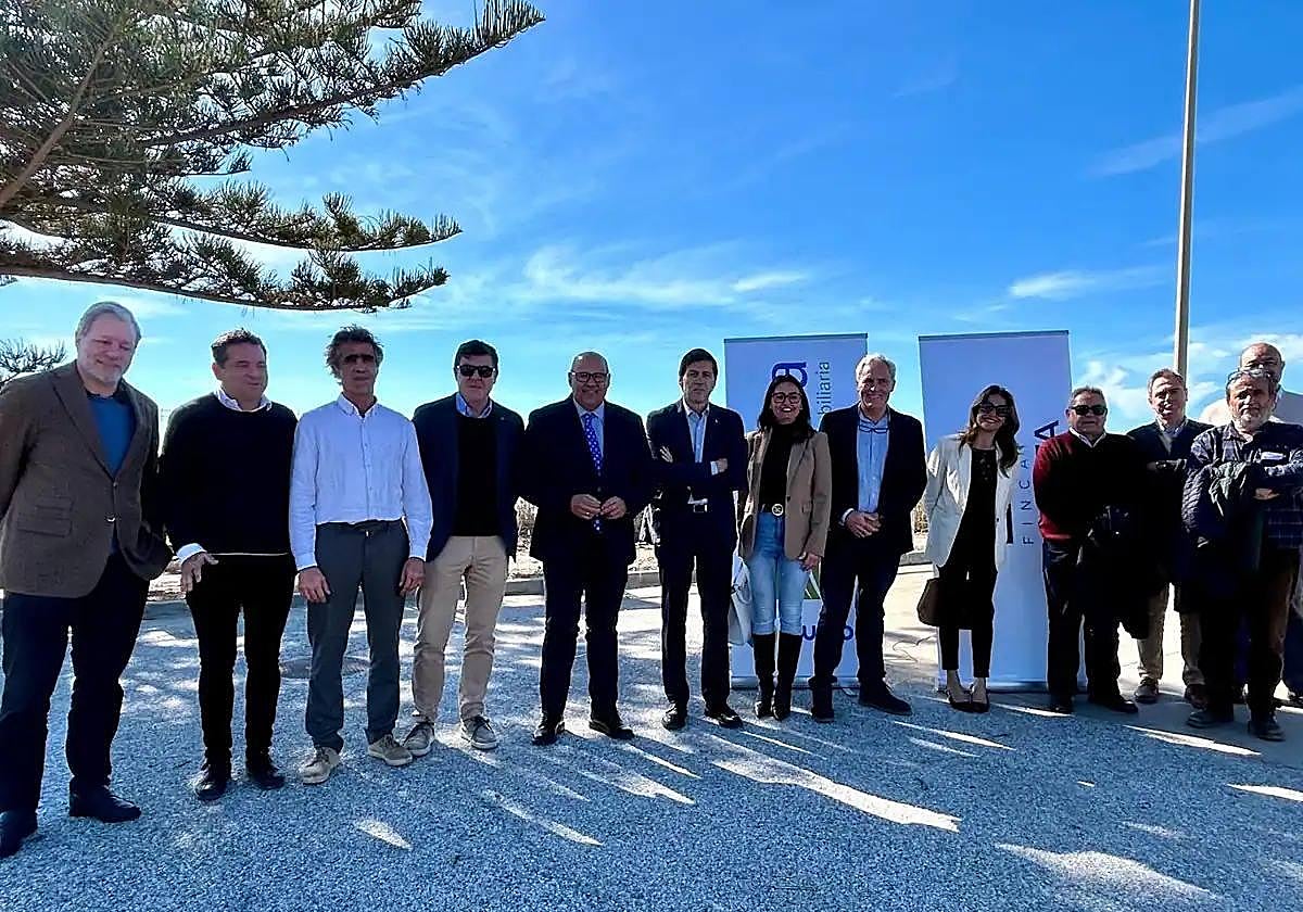 Authorities and promoters pose for a photo in Benajarafe.