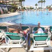 File image of holidaymakers enjoying the sun and swimming pool at a hotel on the Costa del Sol.