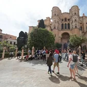 Tourists in the Patio de los Naranjos, alongside Malaga Cathedral, last Easter.