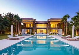 A swimming pool in the garden of a luxury villa in Marbella.