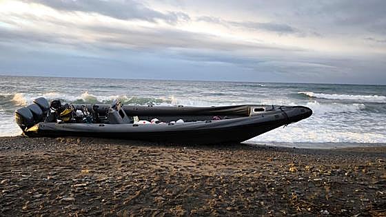 Powerful multi-engined narco-boat runs aground on Costa Tropical beach in bad weather
